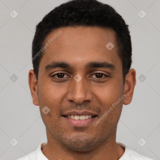 Joyful latino young-adult male with short  black hair and brown eyes