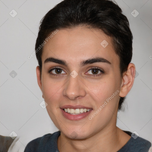 Joyful white young-adult female with medium  brown hair and brown eyes