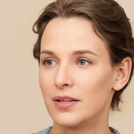 Joyful white young-adult female with medium  brown hair and blue eyes