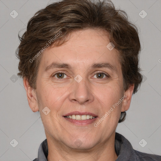 Joyful white adult male with short  brown hair and grey eyes