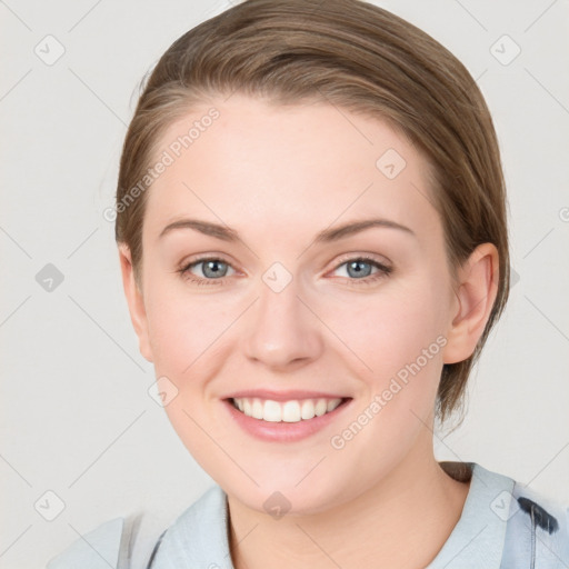 Joyful white young-adult female with medium  brown hair and blue eyes