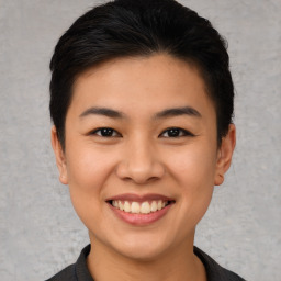 Joyful asian young-adult female with short  black hair and brown eyes