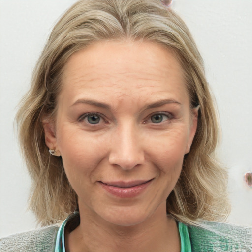 Joyful white young-adult female with medium  brown hair and blue eyes