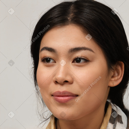 Joyful asian young-adult female with medium  black hair and brown eyes