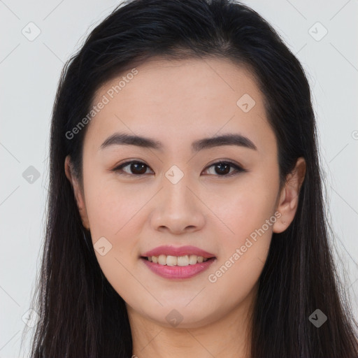 Joyful asian young-adult female with long  brown hair and brown eyes