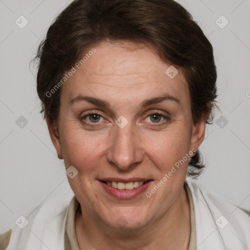 Joyful white adult female with short  brown hair and grey eyes