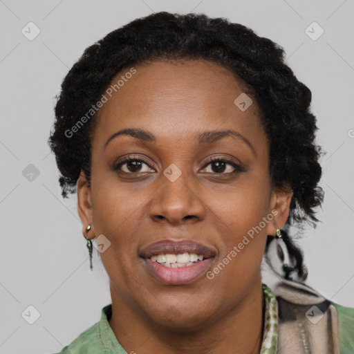 Joyful black adult female with short  black hair and brown eyes