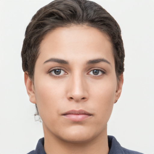 Neutral white young-adult female with short  brown hair and brown eyes