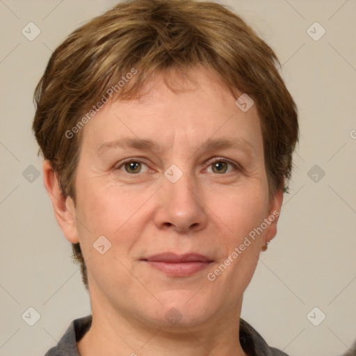 Joyful white adult female with short  brown hair and grey eyes