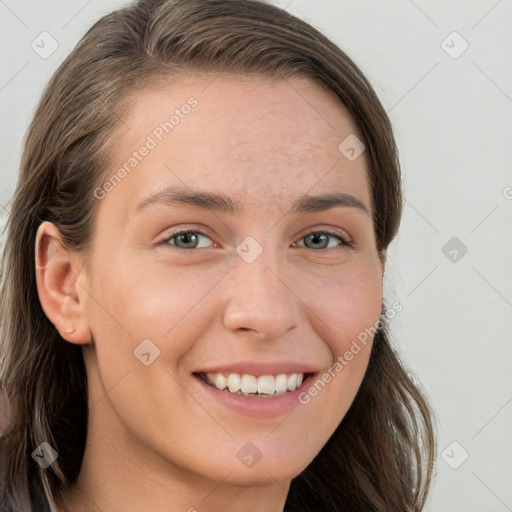 Joyful white young-adult female with long  brown hair and grey eyes