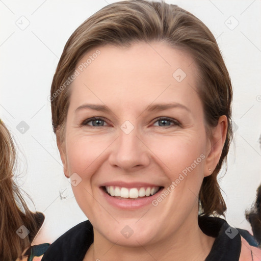 Joyful white young-adult female with medium  brown hair and blue eyes