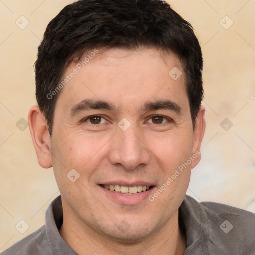 Joyful white young-adult male with short  black hair and brown eyes