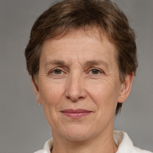 Joyful white middle-aged female with short  brown hair and brown eyes