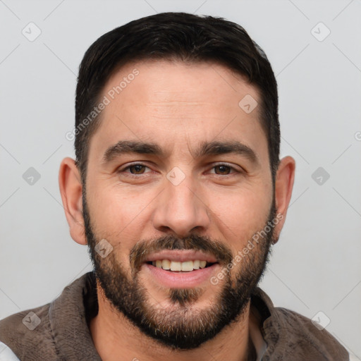 Joyful white young-adult male with short  black hair and brown eyes