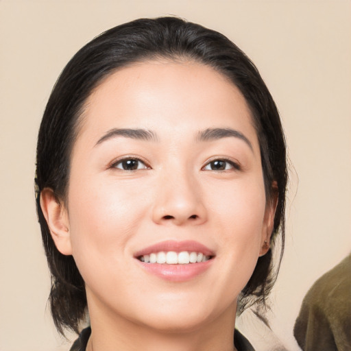 Joyful white young-adult female with medium  brown hair and brown eyes