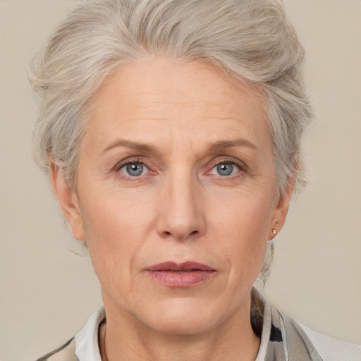 Neutral white middle-aged female with short  blond hair and grey eyes