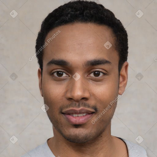 Joyful black young-adult male with short  black hair and brown eyes