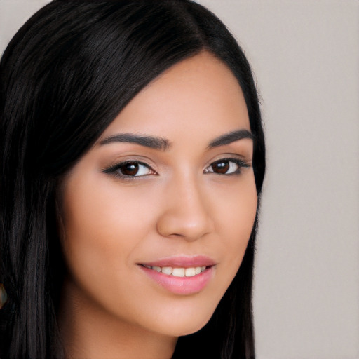 Joyful latino young-adult female with long  brown hair and brown eyes