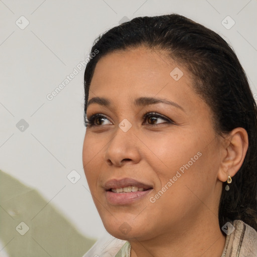 Joyful latino young-adult female with short  black hair and brown eyes