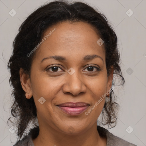 Joyful black adult female with medium  brown hair and brown eyes