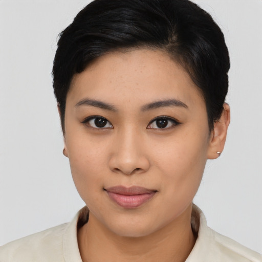 Joyful asian young-adult female with short  black hair and brown eyes