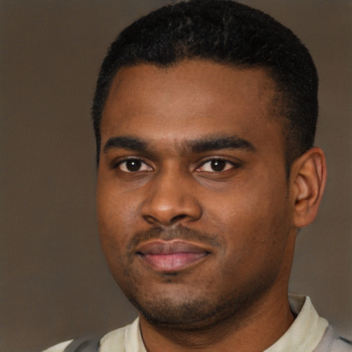 Joyful latino young-adult male with short  brown hair and brown eyes