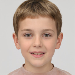 Joyful white child male with short  brown hair and brown eyes