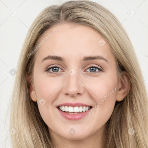 Joyful white young-adult female with long  brown hair and blue eyes