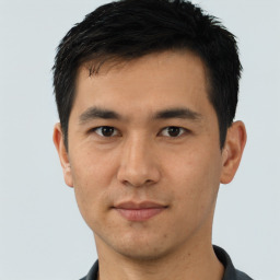 Joyful asian young-adult male with short  black hair and brown eyes