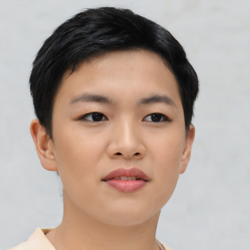 Joyful asian young-adult female with short  black hair and brown eyes