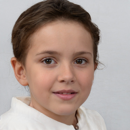 Joyful white child female with short  brown hair and brown eyes