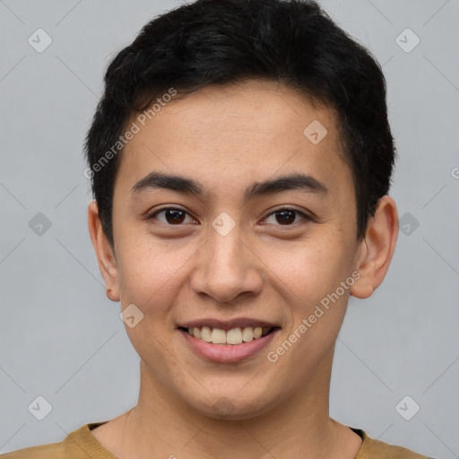 Joyful latino young-adult male with short  brown hair and brown eyes