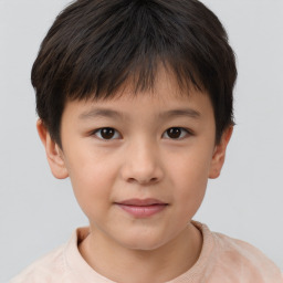 Joyful white child female with short  brown hair and brown eyes