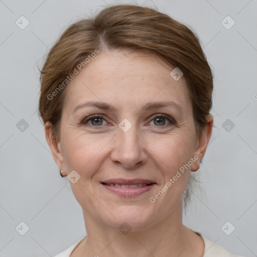 Joyful white adult female with medium  brown hair and grey eyes