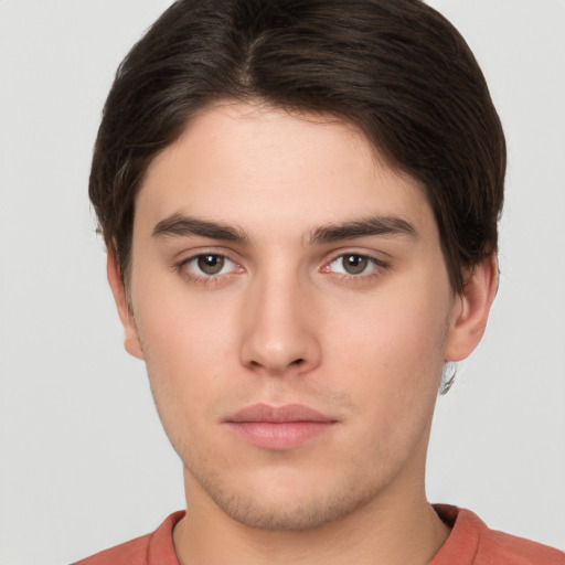 Neutral white young-adult male with short  brown hair and brown eyes