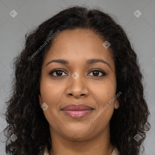 Joyful black young-adult female with long  brown hair and brown eyes