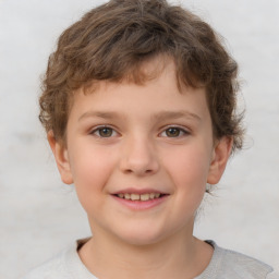 Joyful white child male with short  brown hair and brown eyes