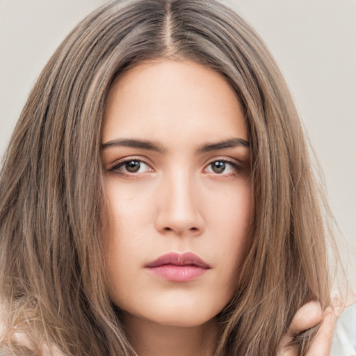 Neutral white young-adult female with long  brown hair and brown eyes