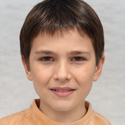 Joyful white child male with short  brown hair and brown eyes