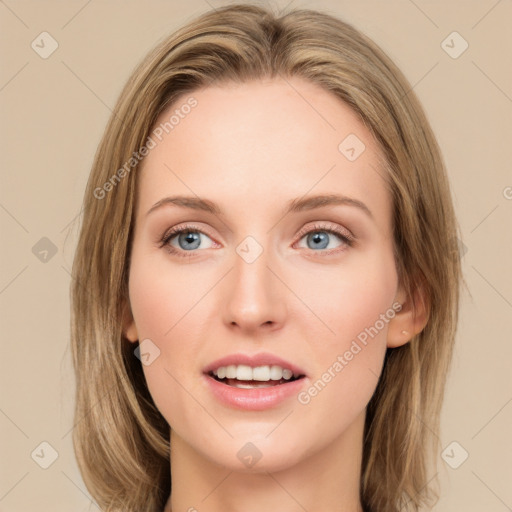 Joyful white young-adult female with long  brown hair and green eyes