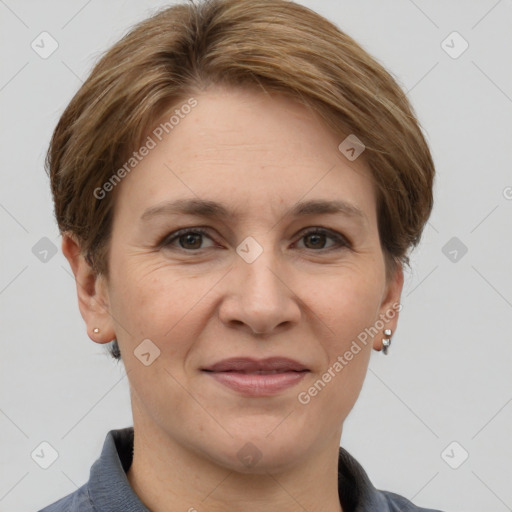 Joyful white adult female with short  brown hair and grey eyes