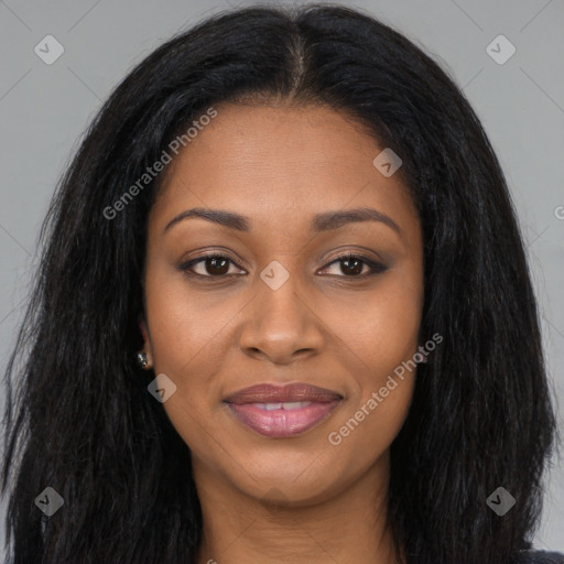 Joyful black young-adult female with long  brown hair and brown eyes