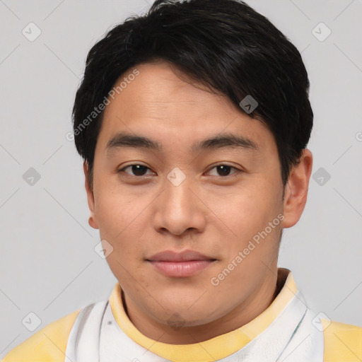 Joyful asian young-adult male with short  brown hair and brown eyes