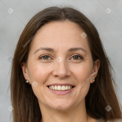 Joyful white adult female with long  brown hair and brown eyes