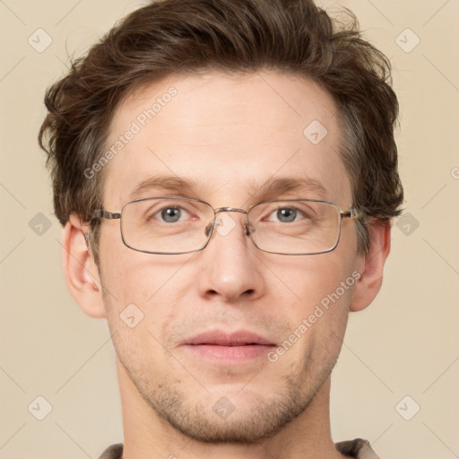 Joyful white adult male with short  brown hair and grey eyes