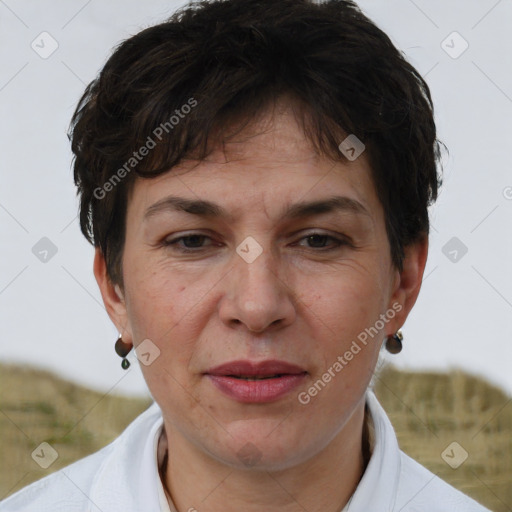 Joyful white adult female with short  brown hair and brown eyes