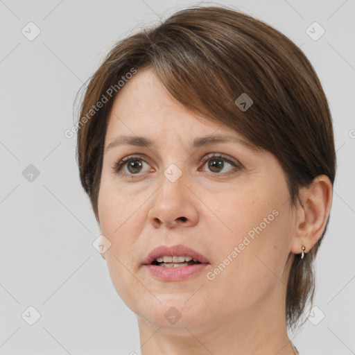 Joyful white adult female with medium  brown hair and brown eyes