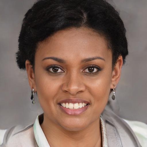 Joyful latino young-adult female with short  brown hair and brown eyes