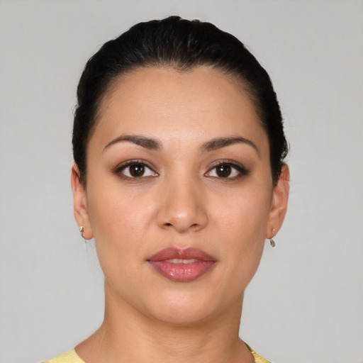 Joyful white young-adult female with short  black hair and brown eyes