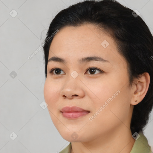 Joyful black young-adult female with medium  brown hair and brown eyes